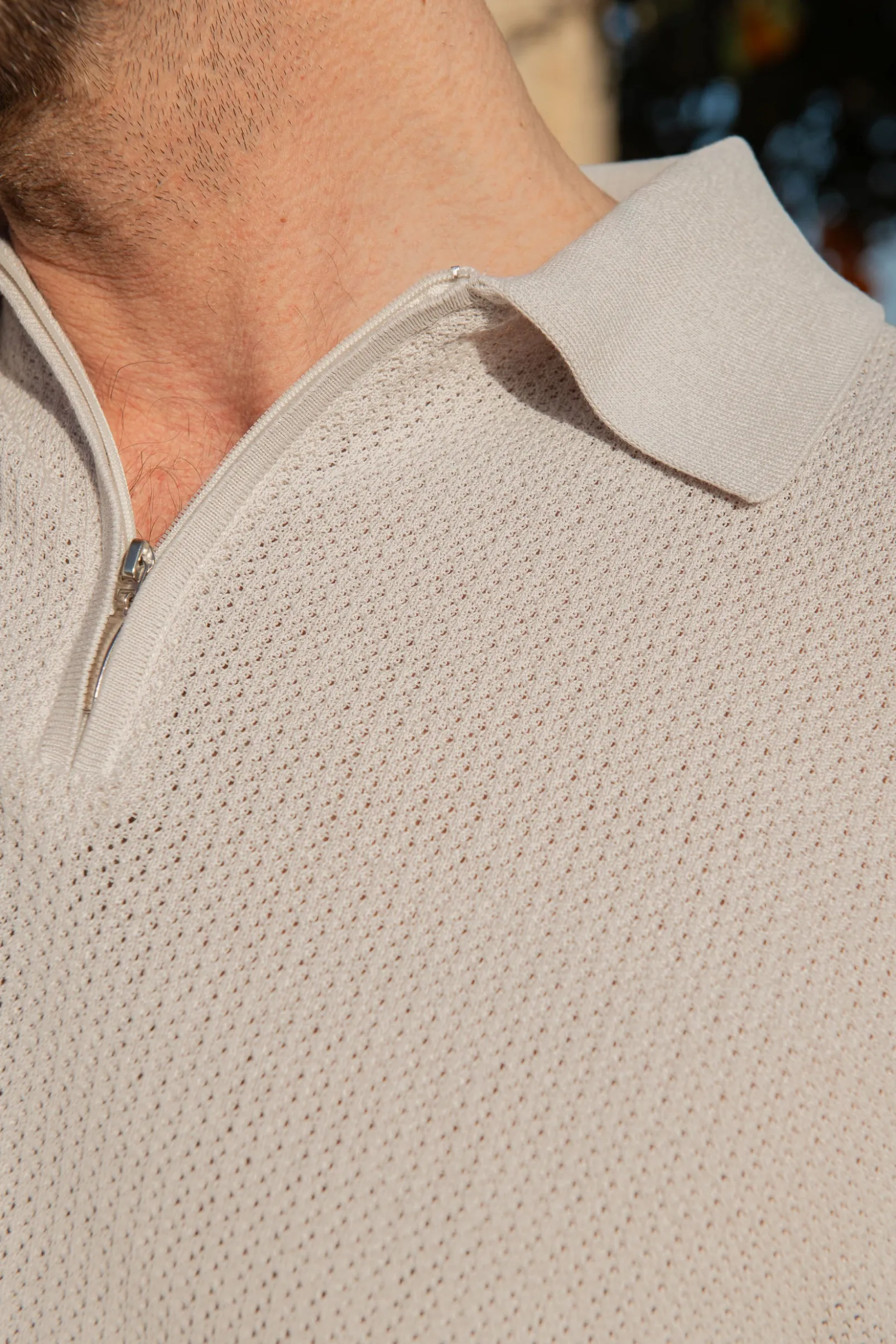 stone_textured_knit_polo__1.webp Stone textured knit polo with zip - Made in Italy